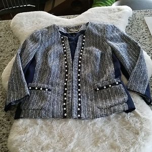 Pearl embellishments on navy tweed jacket